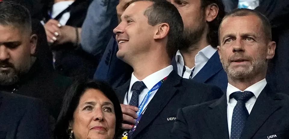 Officials watching the match in the stands