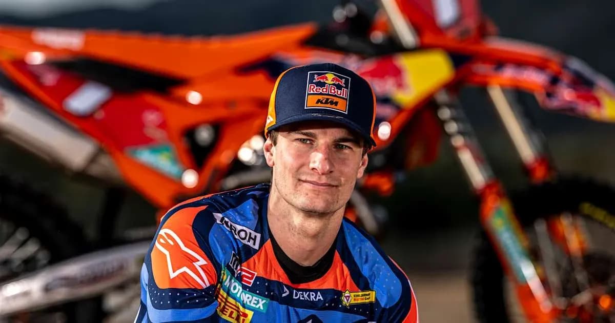 Motocross rider posing with KTM motorcycle