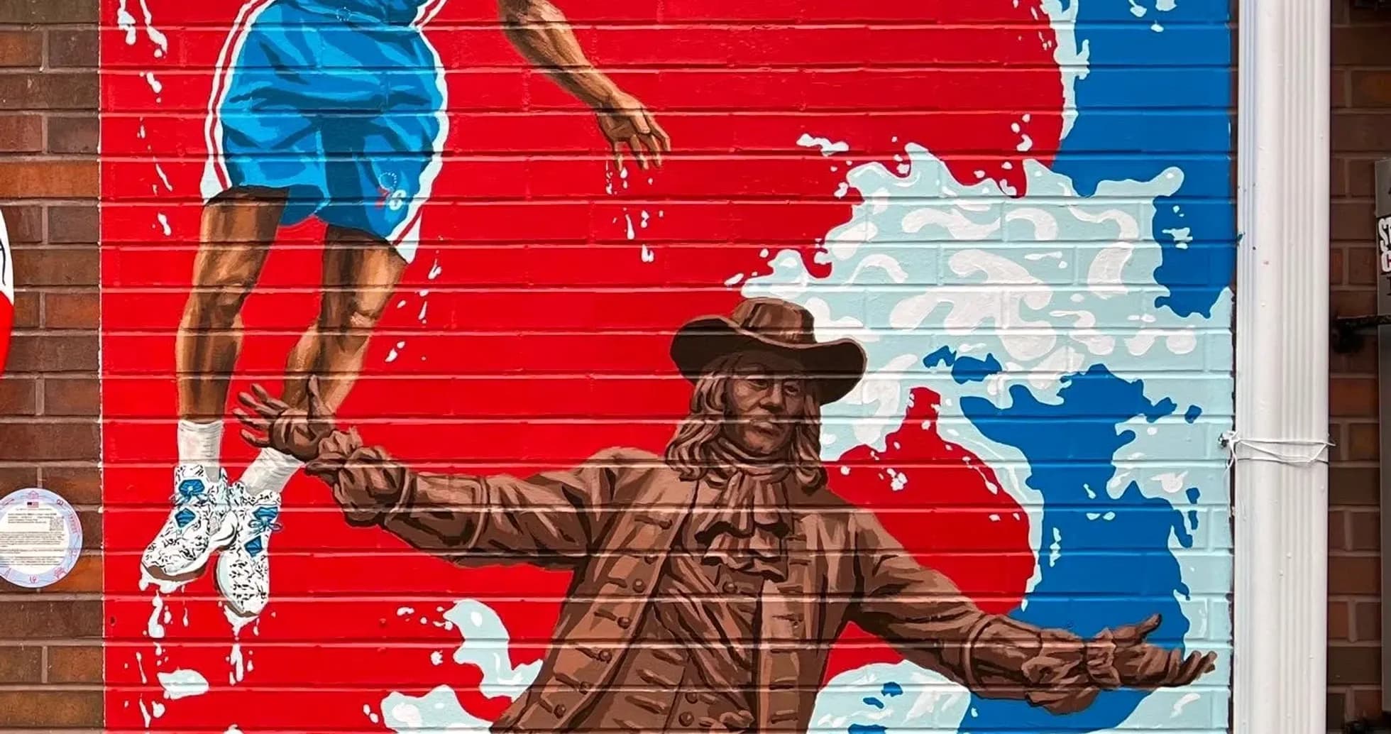 Mural of basketball player and historical figure