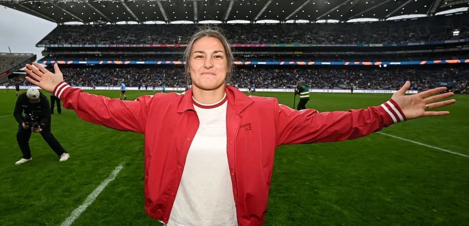 Athlete celebrating on the field with outstretched arms