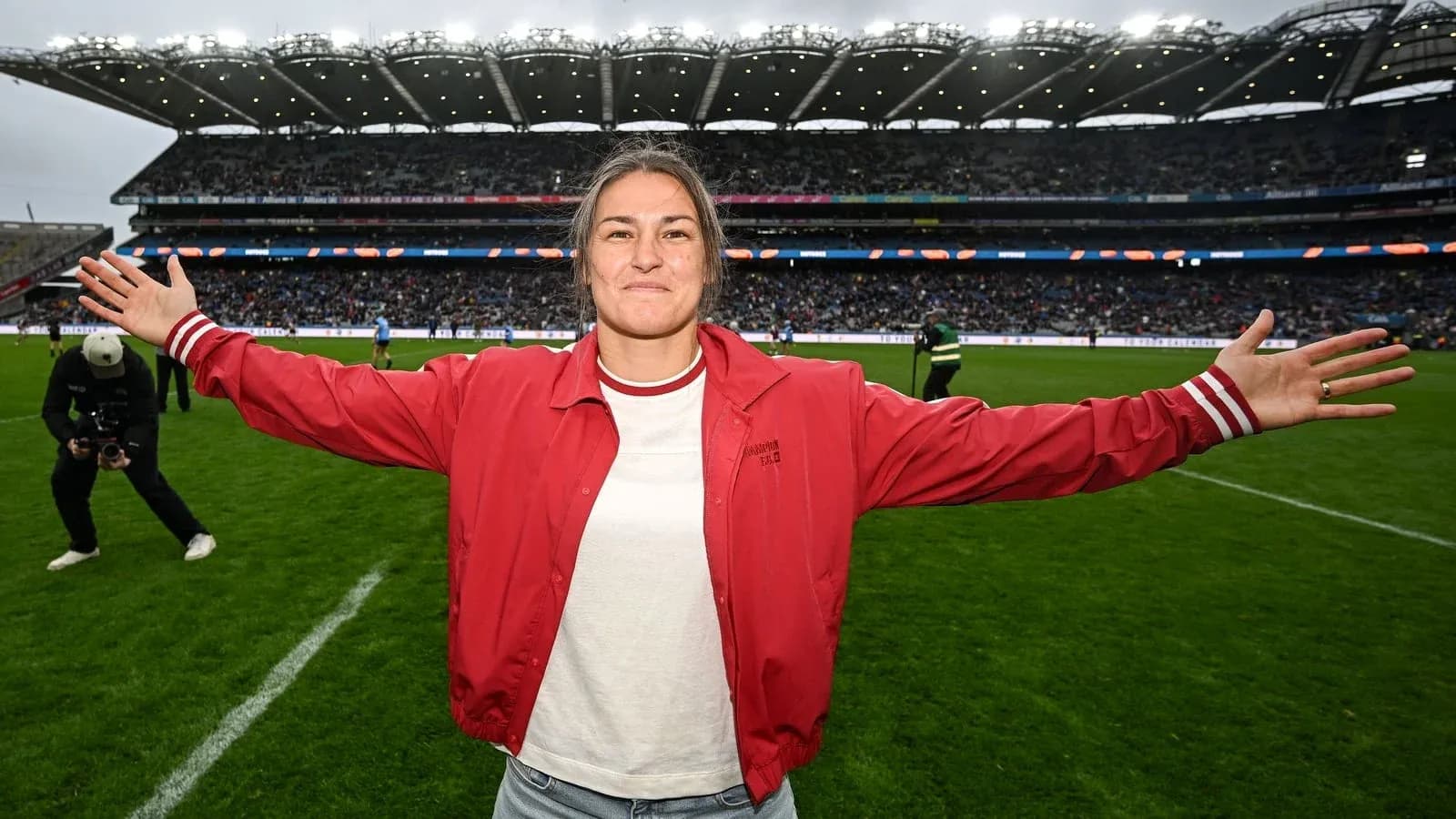 Athlete celebrating on the field with outstretched arms