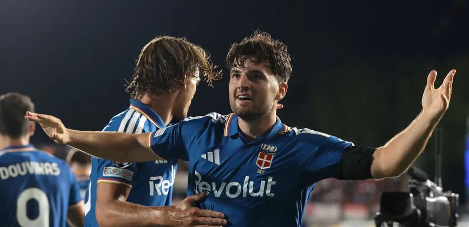 Football players celebrating a goal on the pitch