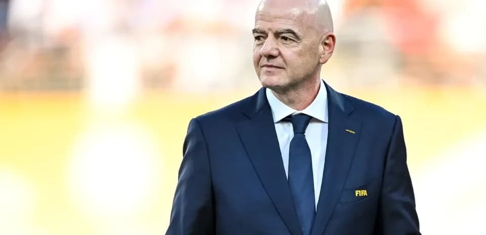 FIFA president walking at a sporting event