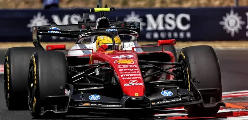 Ferrari F1 car navigating a racing track