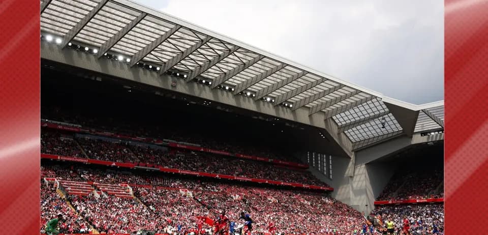 Fans watching match at Anfield stadium