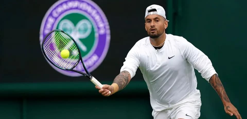 Tennis player preparing to hit a ball at Wimbledon