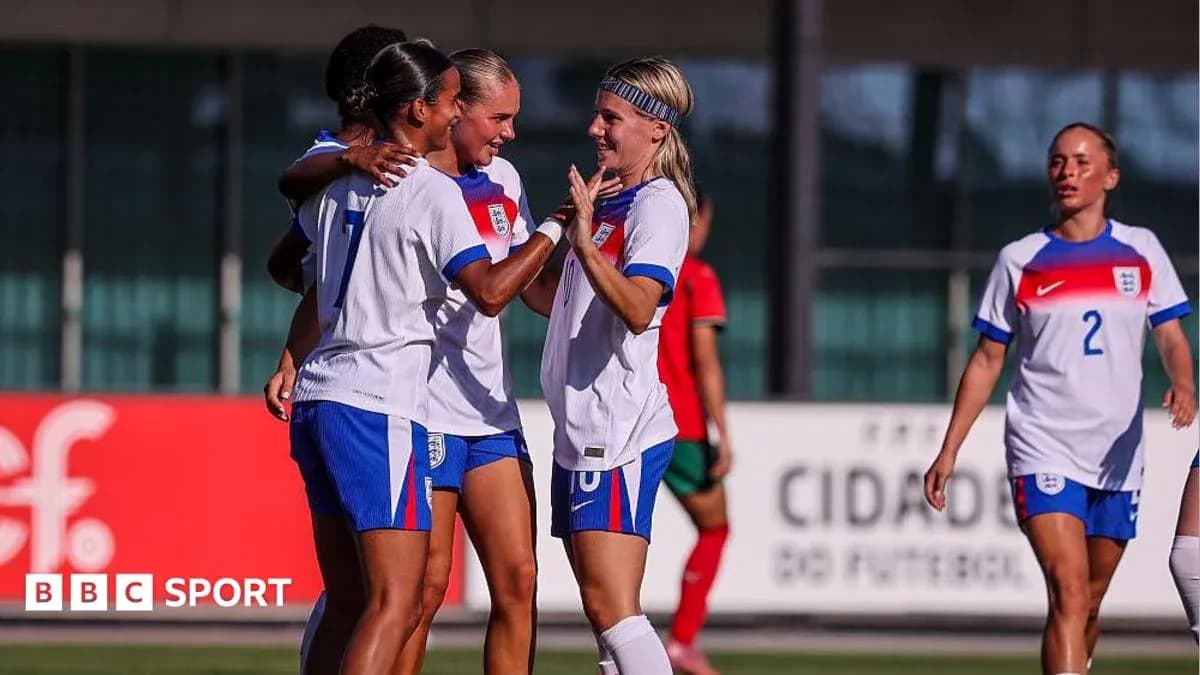 England players celebrating a goal during match
