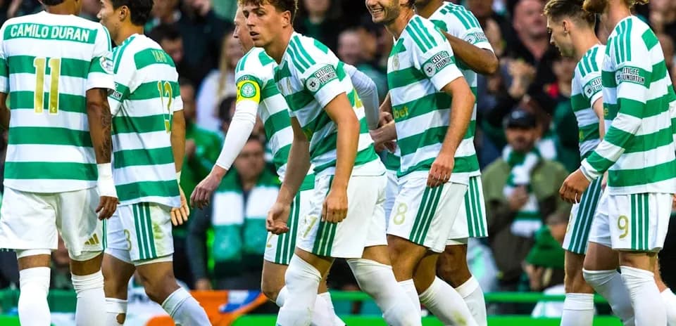 Celtic players celebrating a goal during match