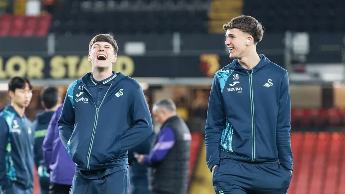 Swansea City players laughing during warm-up session Swansea City players laughing during warm-up session
