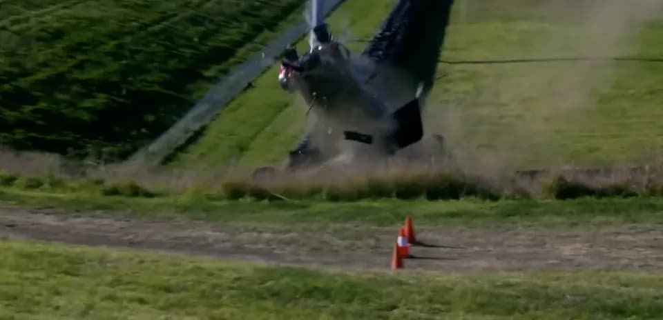 Helicopter losing control and crashing on hillside