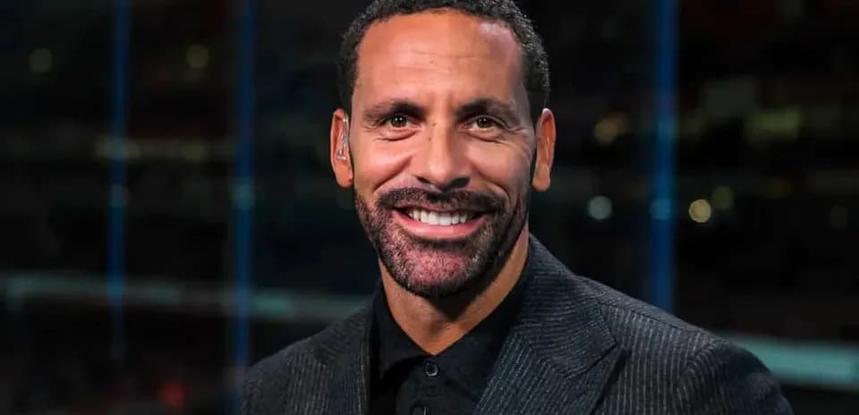 Sport commentator smiling in studio setting