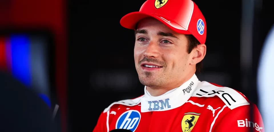 Formula 1 driver speaking in Ferrari team attire