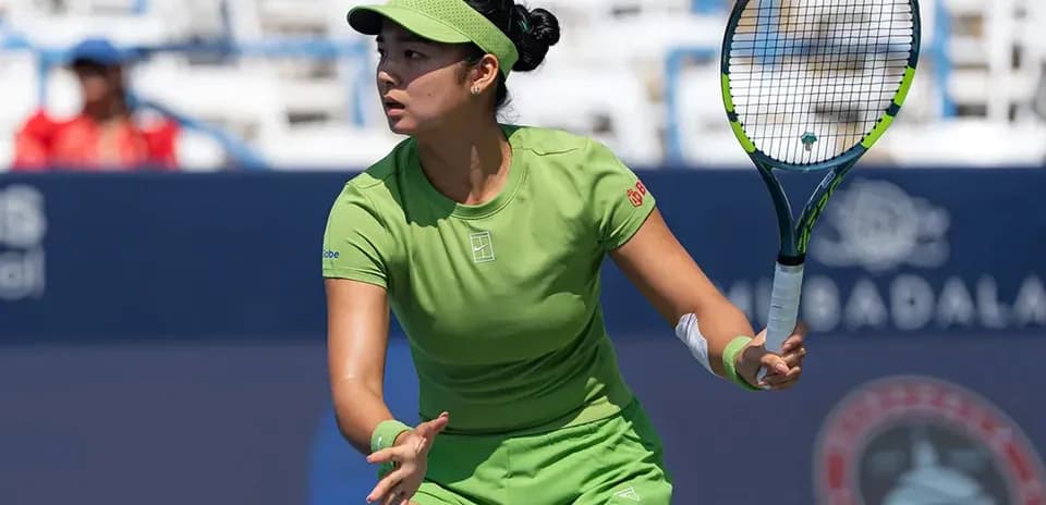 Tennis player preparing to hit a forehand stroke