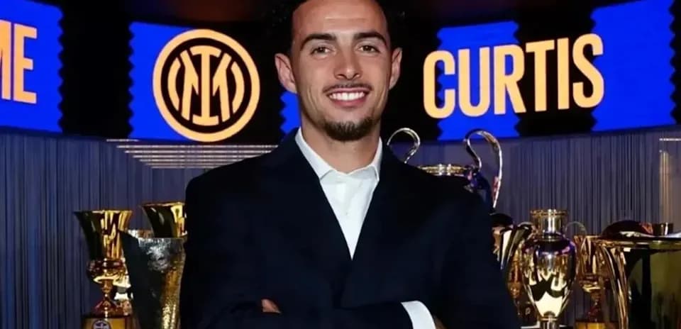 Man posing with trophies at Inter Milan event