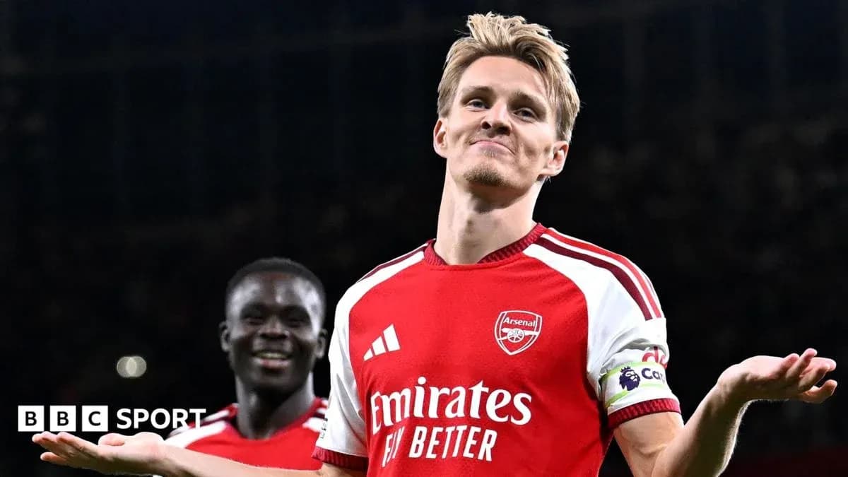 Arsenal player celebrating with teammates after scoring