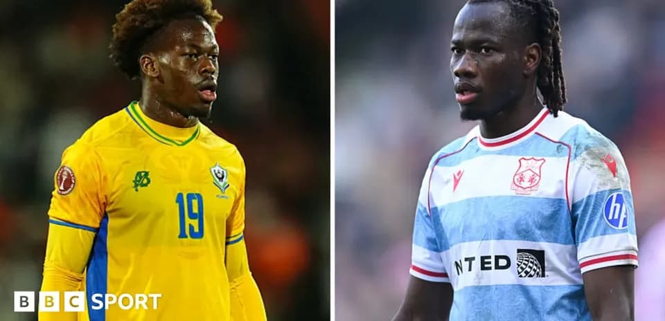 Two football players in match action poses