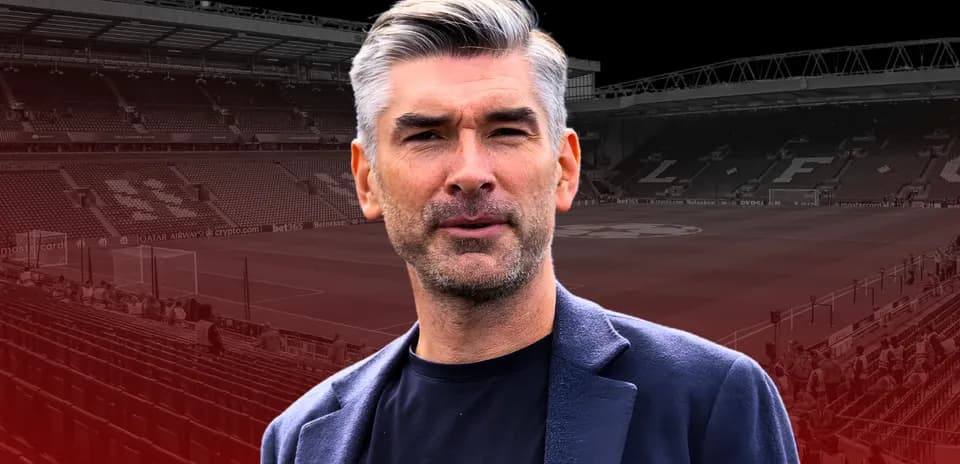 Man in blazer at football stadium before match