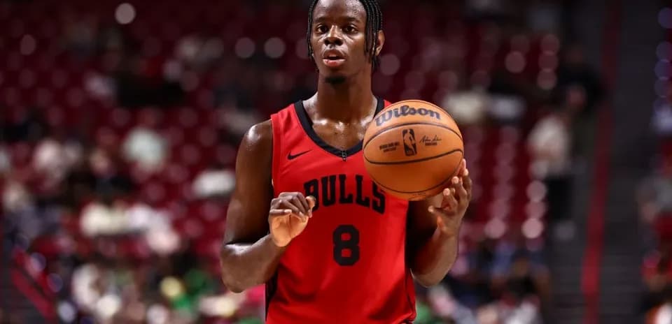 Bulls player holding basketball during game warm-up