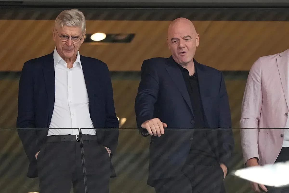 Two officials observing an event from a balcony