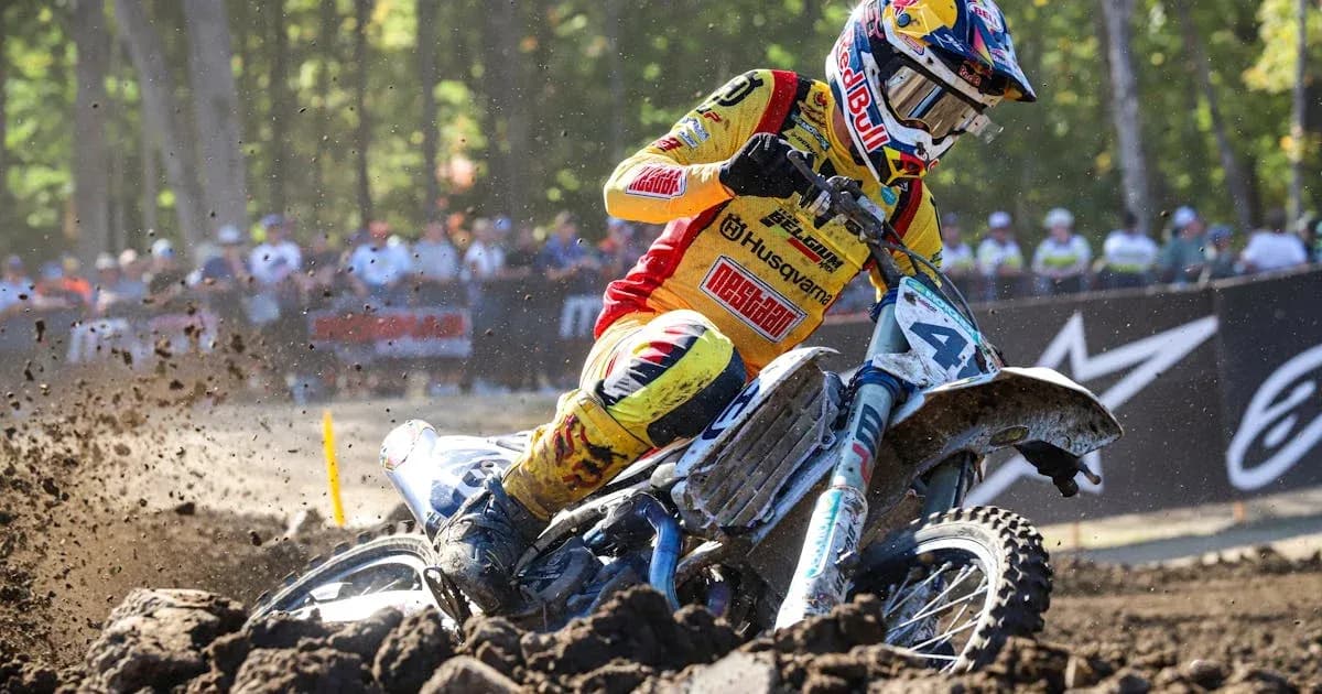Motocross rider navigating through muddy terrain Motocross rider navigating through muddy terrain