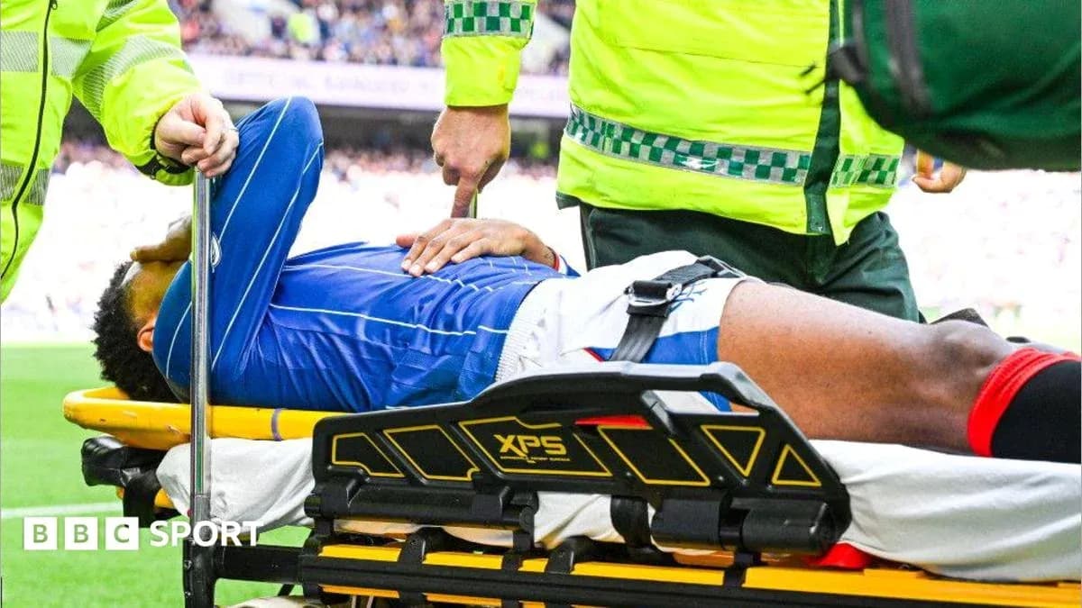Player being stretchered off by medical personnel Player being stretchered off by medical personnel