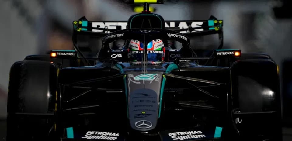 Mercedes F1 car racing on track during event