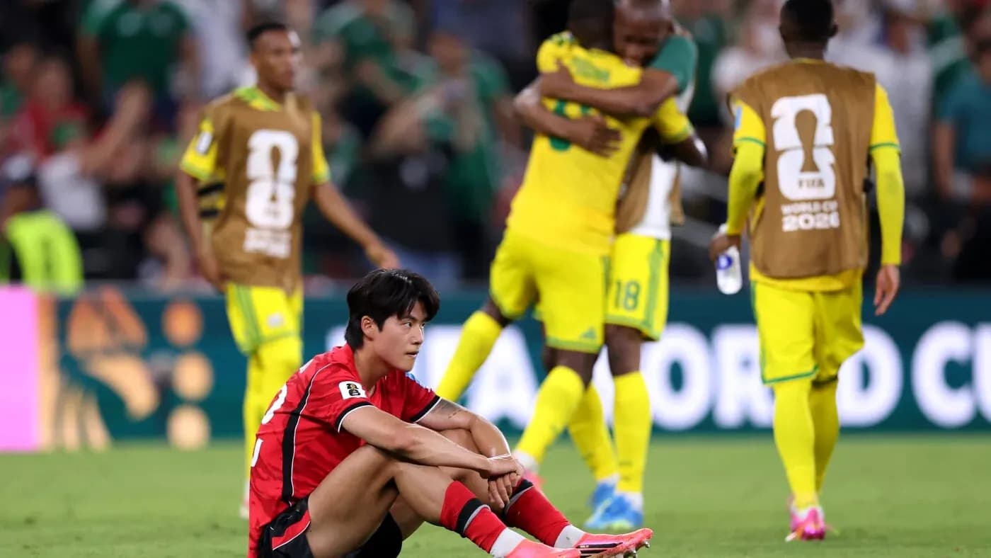 South Korean player sitting on field after match