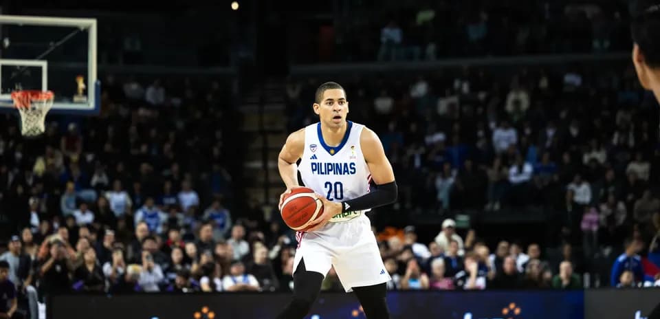 Basketball player dribbling ball during match