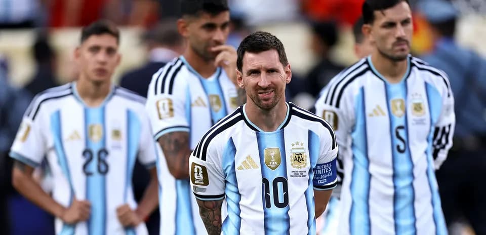 Argentina players standing during match, Messi in focus