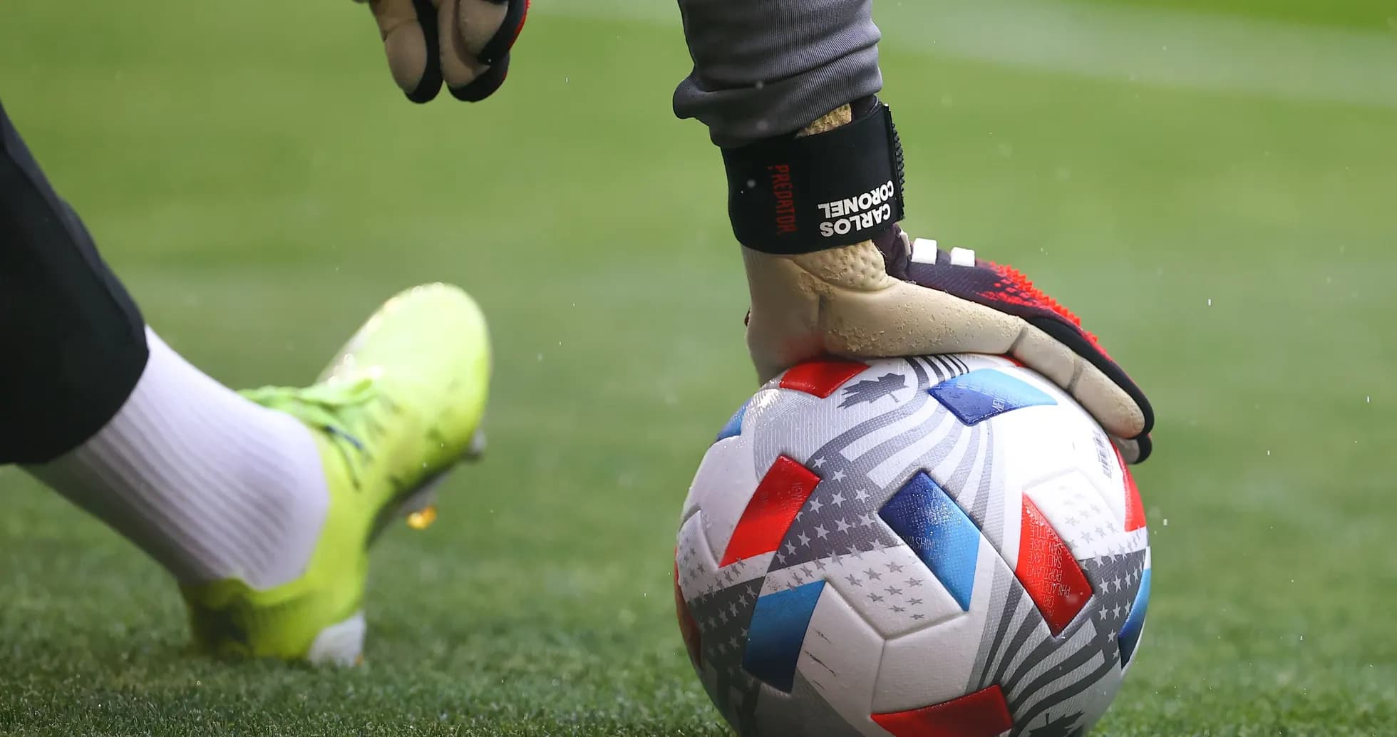 Goalkeeper placing ball on the field before kick