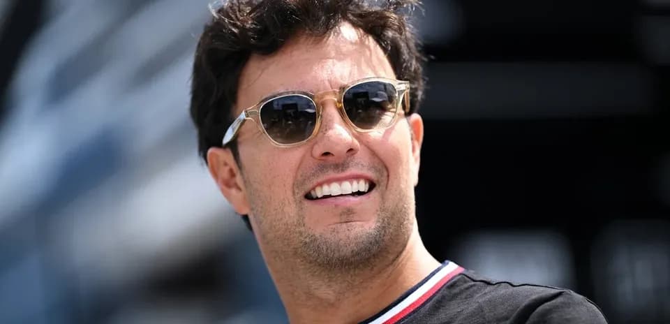 Driver wearing sunglasses at racing event