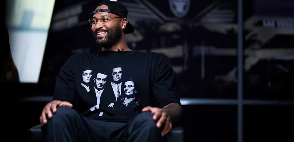 Player wearing black t-shirt during interview setting