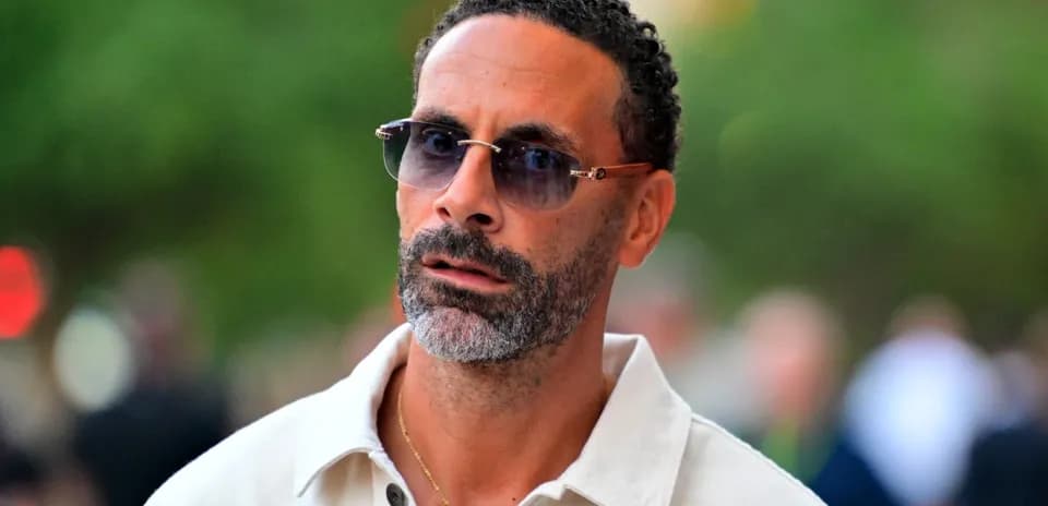 Man wearing sunglasses, walking outdoors