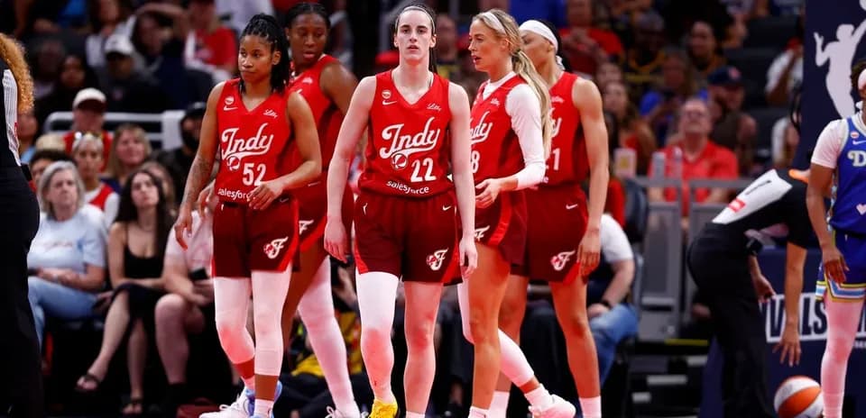 Indy players walking on court during game
