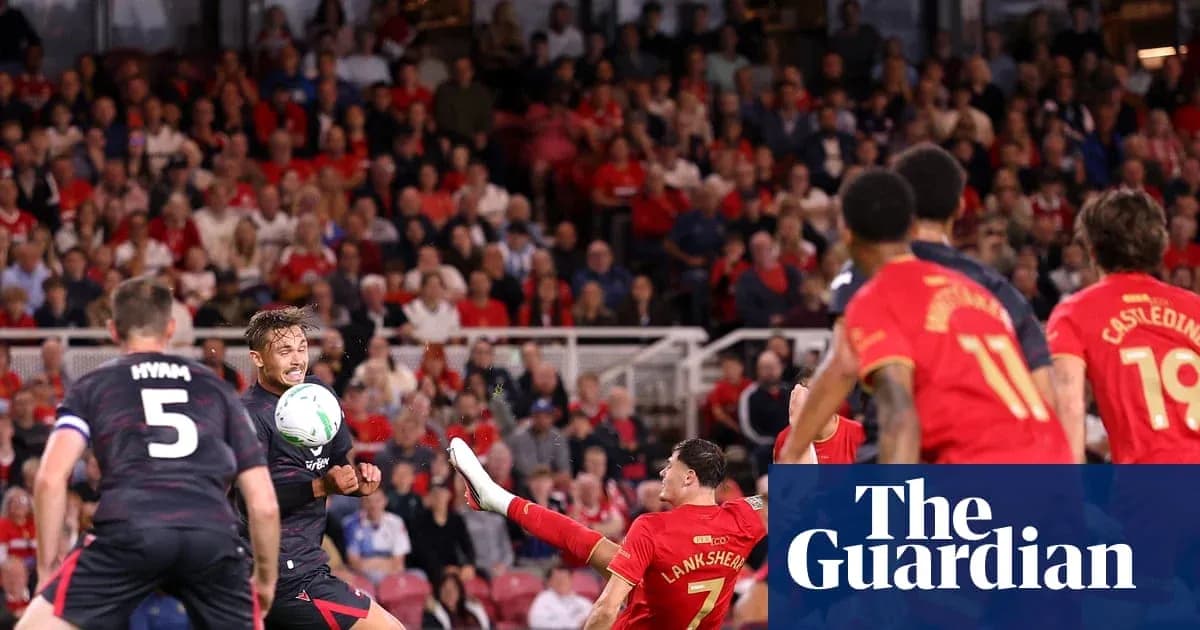 Player kicking ball during competitive football match Player kicking ball during competitive football match