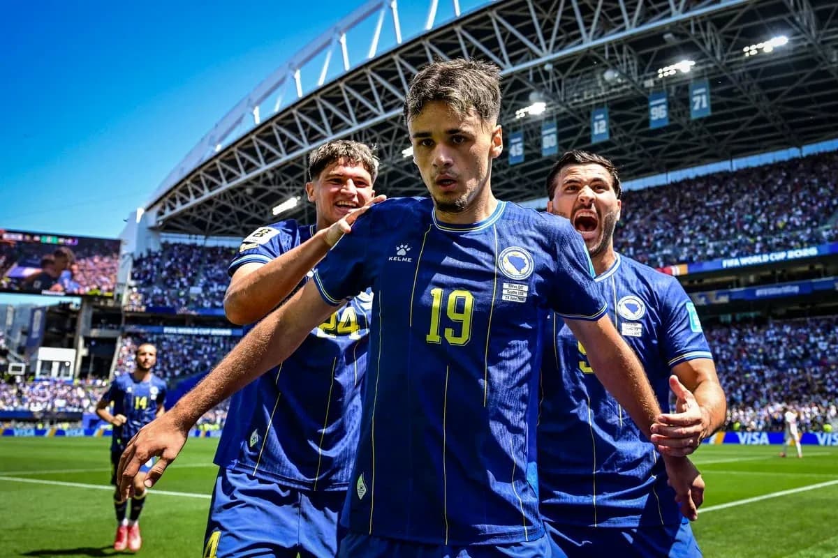 Bosnia players celebrating after a goal in match Bosnia players celebrating after a goal in match