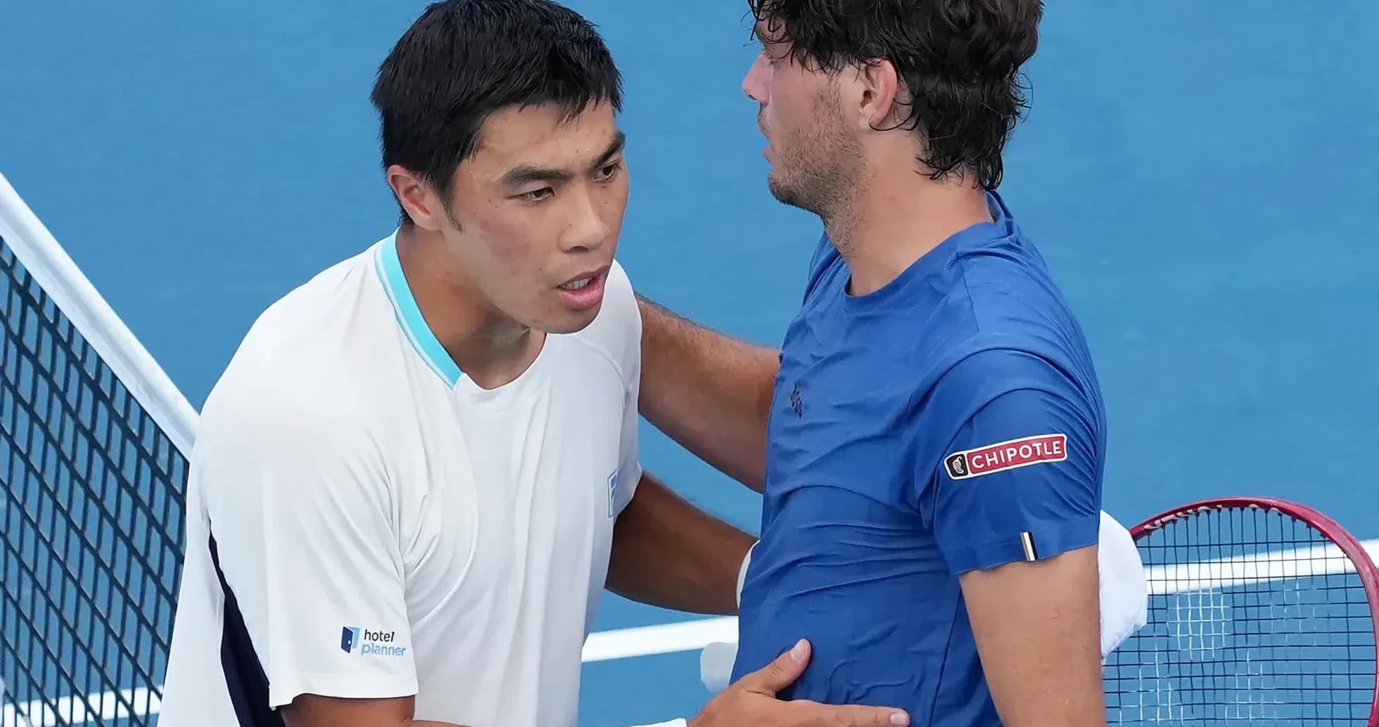 Tennis players shaking hands at the net Tennis players shaking hands at the net