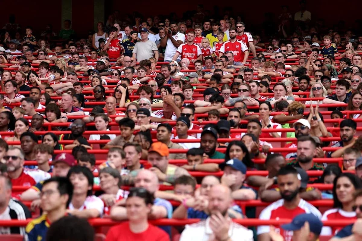 Arsenal fans in stands during a match Arsenal fans in stands during a match