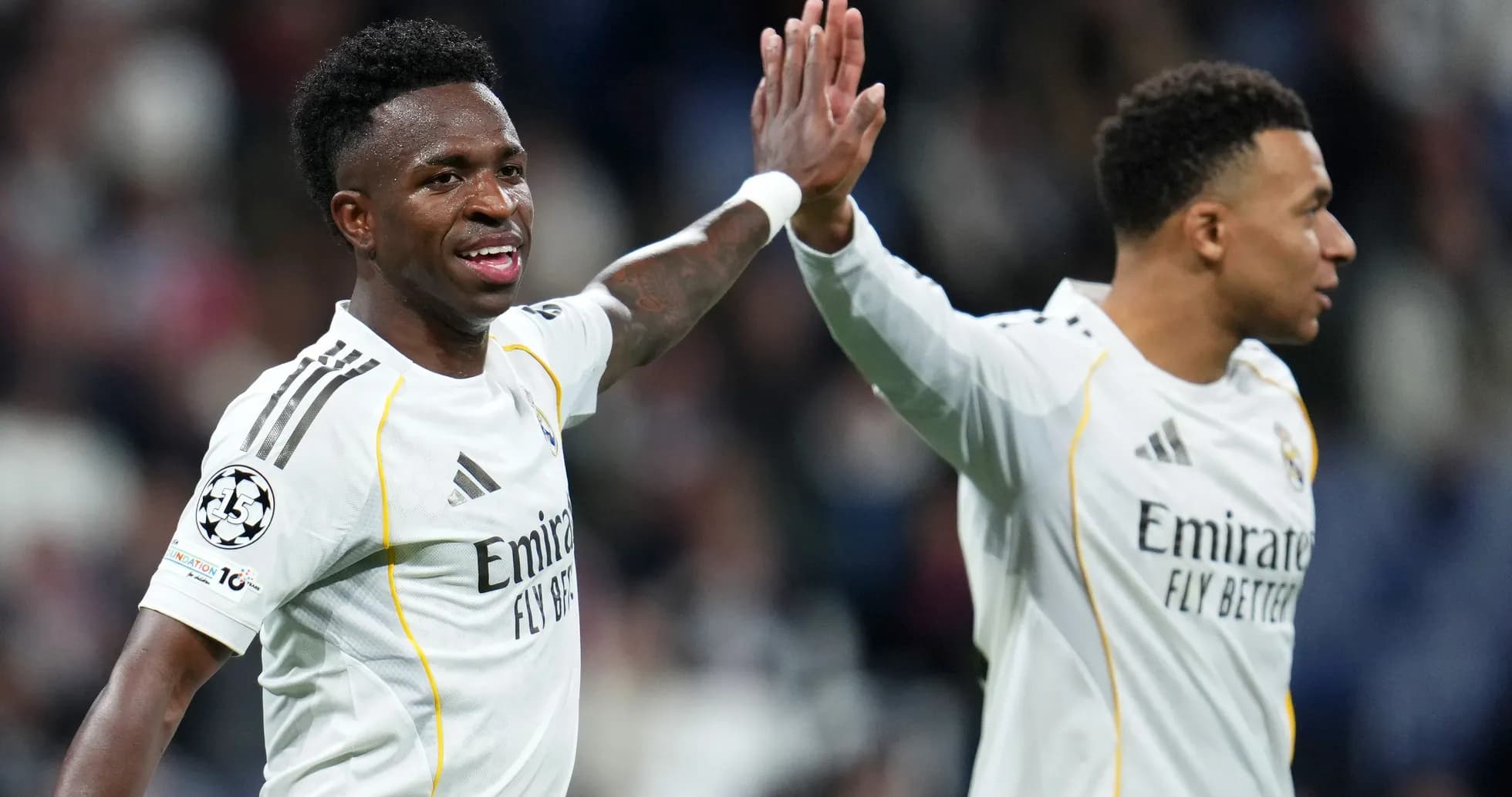 Vinicius Jr. and teammate celebrating during match Vinicius Jr. and teammate celebrating during match