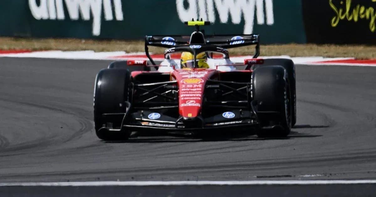 Formula 1 car navigating a turn on racetrack Formula 1 car navigating a turn on racetrack