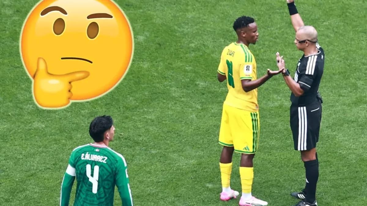 Player discussing with referee during football match Player discussing with referee during football match