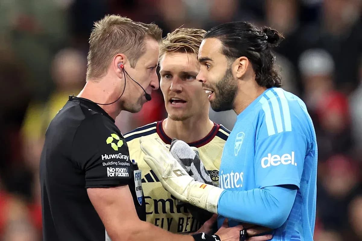 Goalkeeper and players discussing with referee during match Goalkeeper and players discussing with referee during match