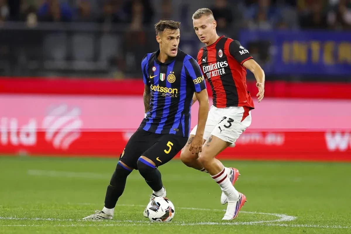 Inter and Milan players contesting the ball during match Inter and Milan players contesting the ball during match