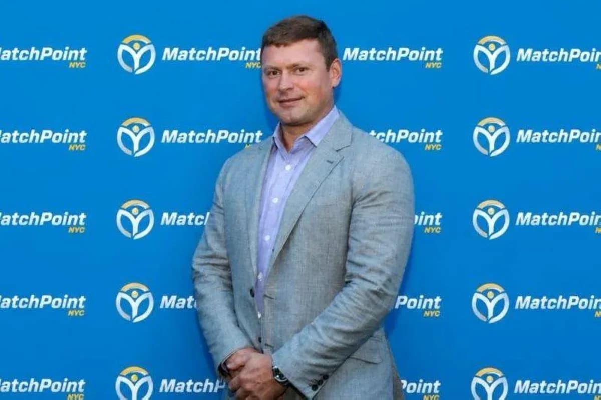Man posing in front of MatchPoint NYC backdrop Man posing in front of MatchPoint NYC backdrop
