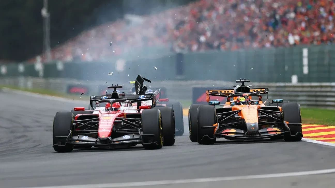 Ferrari and McLaren cars racing with debris flying Ferrari and McLaren cars racing with debris flying