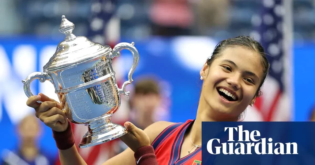 Tennis player holding US Open trophy proudly Tennis player holding US Open trophy proudly
