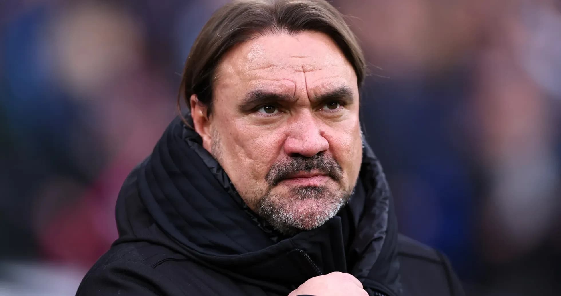 Football manager looking serious on the sidelines Football manager looking serious on the sidelines