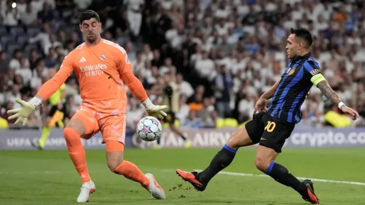 Goalkeeper blocking shot from opposing player during match Goalkeeper blocking shot from opposing player during match