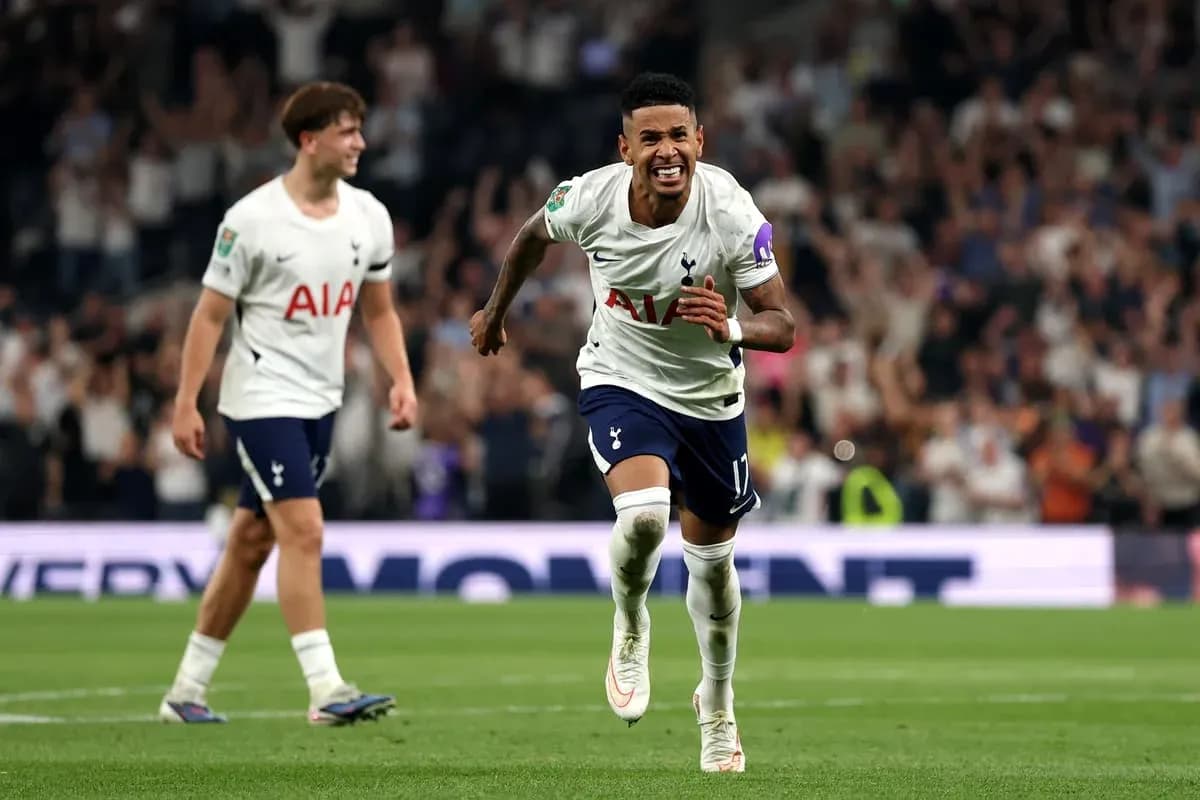 Tottenham players celebrating a goal in match Tottenham players celebrating a goal in match