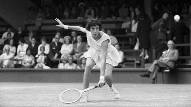 Tennis player returning a shot on the court Tennis player returning a shot on the court